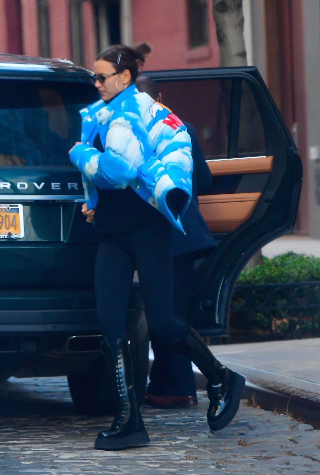 174463663_irina-shayk-in-a-sky-and-cloud-print-puffy-jacket-in-nyc-11-24-2020-6.jpg