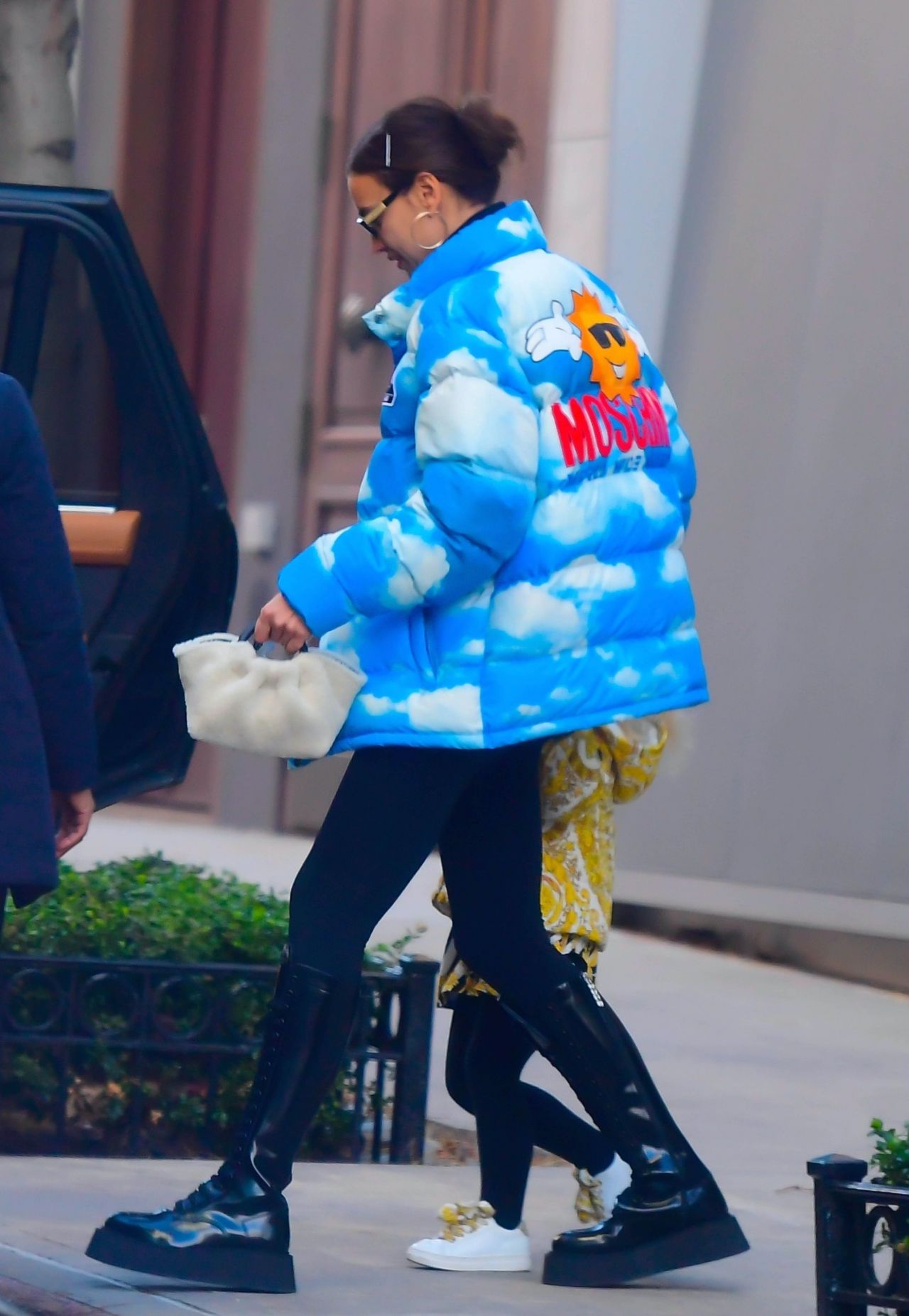 174463664_irina-shayk-in-a-sky-and-cloud-print-puffy-jacket-in-nyc-11-24-2020-5.jpg