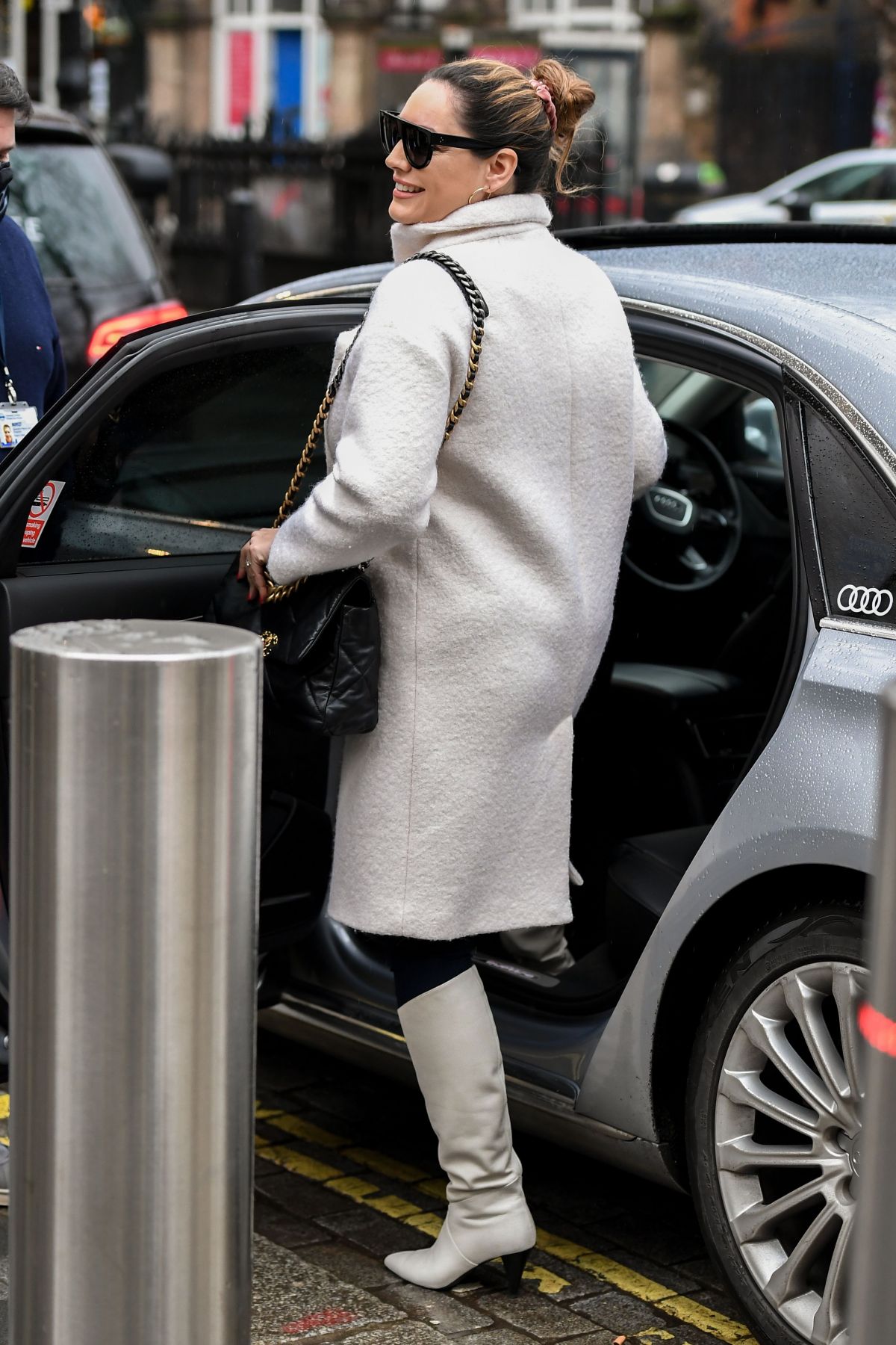 179310298_kelly-brook-in-a-white-coat-and-boots-at-global-radio-in-london-12-23-2020-8.jpg