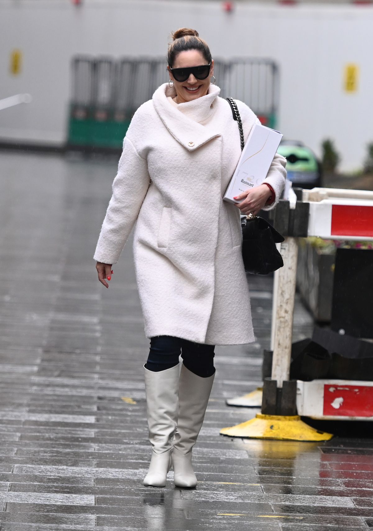 179310301_kelly-brook-in-a-white-coat-and-boots-at-global-radio-in-london-12-23-2020-9.jpg