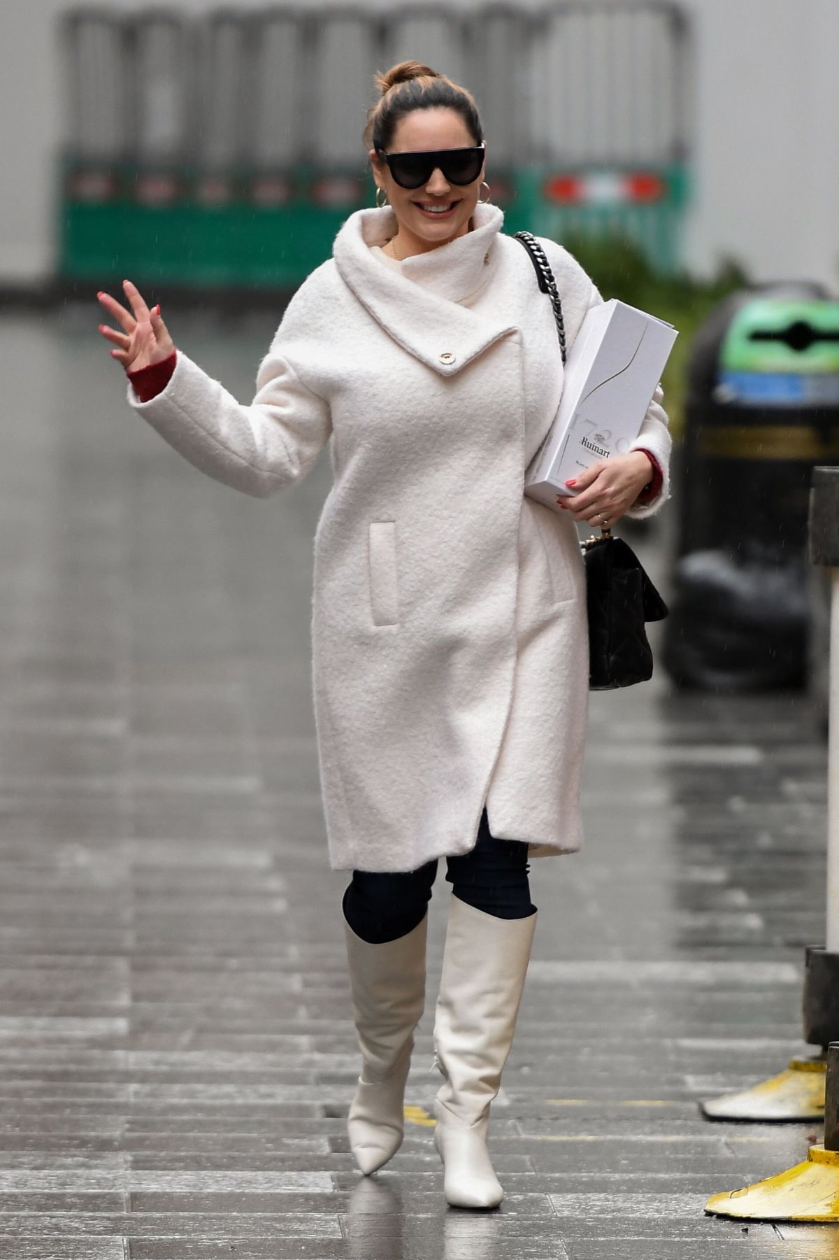 179310288_kelly-brook-in-a-white-coat-and-boots-at-global-radio-in-london-12-23-2020-4.jpg
