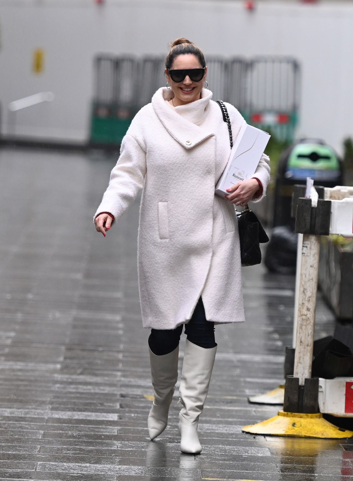 179310292_kelly-brook-in-a-white-coat-and-boots-at-global-radio-in-london-12-23-2020-6.jpg