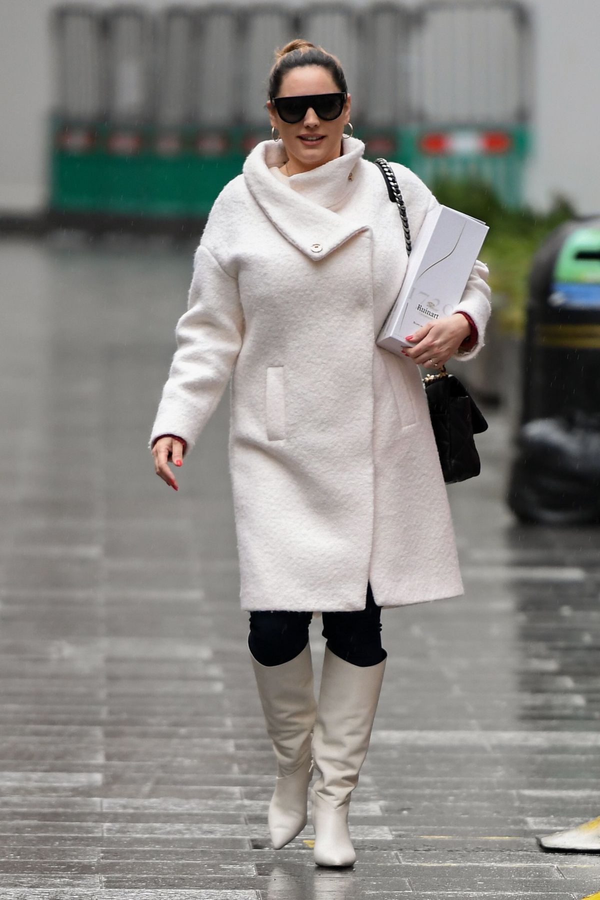 179310280_kelly-brook-in-a-white-coat-and-boots-at-global-radio-in-london-12-23-2020-0.jpg